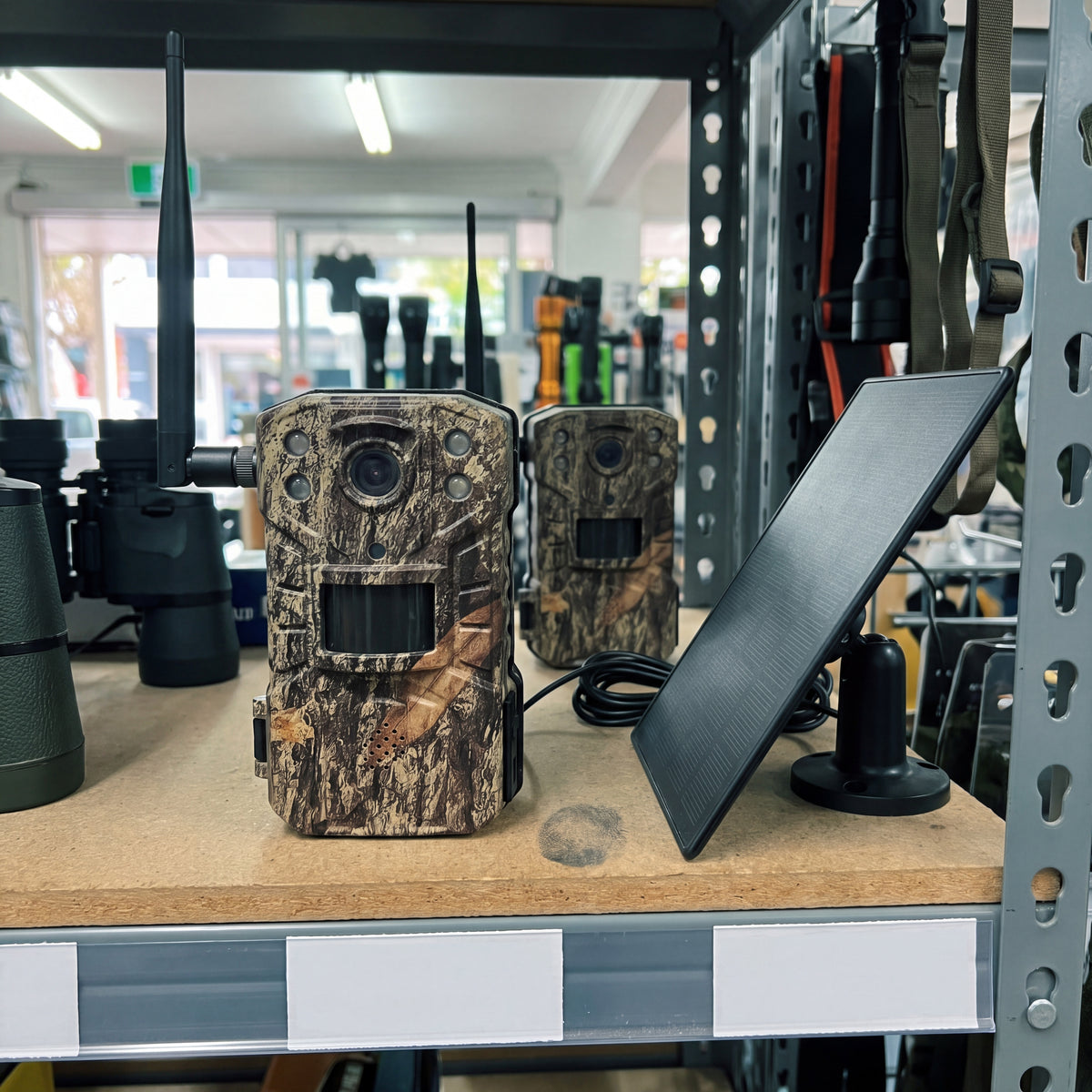 KelpieCam Ranger 4G solar trail camera and solar panel on a shelf in an Australian outdoor store